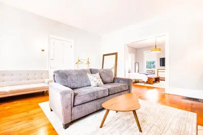 a living room with a couch and a table at Hudson Mariner in Hudson
