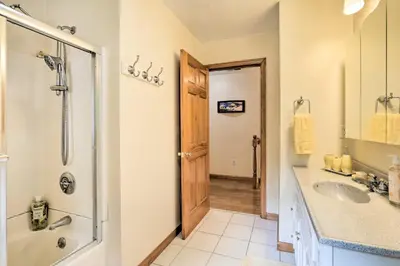 a bathroom with a shower and a sink at Granby Home with Deck Less Than half Mi to Aldrich Lake! in Granby