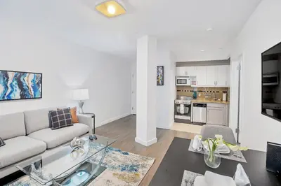 a living room with a couch and a table at National at 888 Sixth Avenue - Furnished Apartments in New York