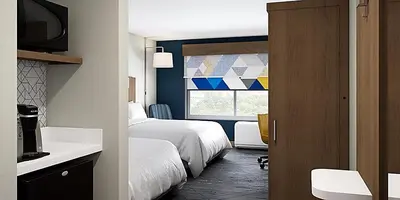 a hotel room with two beds and a window at Holiday Inn Express - New Rochelle by IHG in New Rochelle