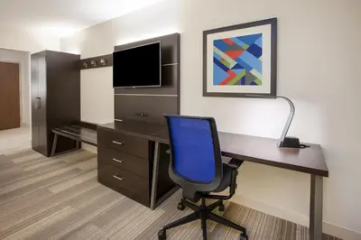 an office with a desk with a computer and a chair at Holiday Inn Express - New Rochelle by IHG in New Rochelle