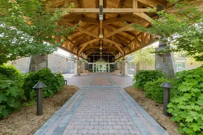 a walkway in a building with a wooden ceiling at Sleepy Hollow Hotel in Tarrytown