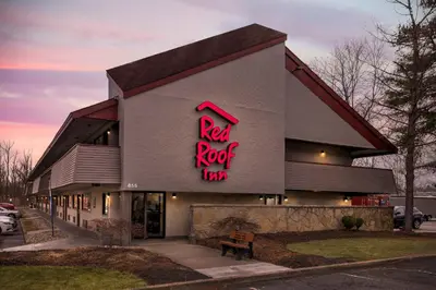 a red rock inn sign on the side of a building at Red Roof Inn Parsippany in Parsippany