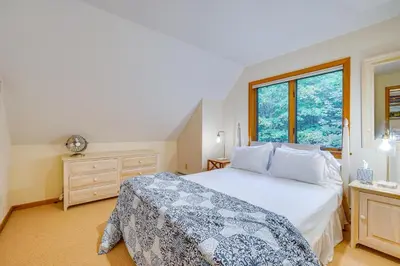 a bedroom with a large bed and a window at Spacious Dover Refuge about 5 Mi to Mount Snow! in Dover