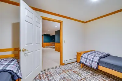 a bedroom with two beds and an open door at Spacious Dover Refuge about 5 Mi to Mount Snow! in Dover