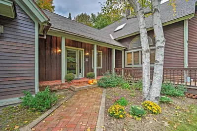 a home with a brick walkway leading to the front door at Spacious Dover Refuge about 5 Mi to Mount Snow! in Dover