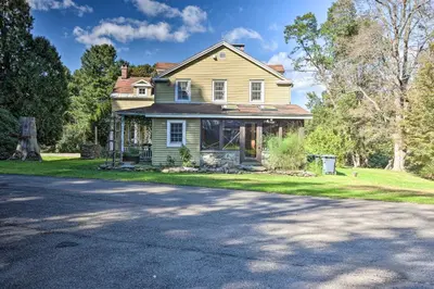 a house with a driveway in front of it at Waterfalls and Trails at The Mills At Green Hole in Hillsdale