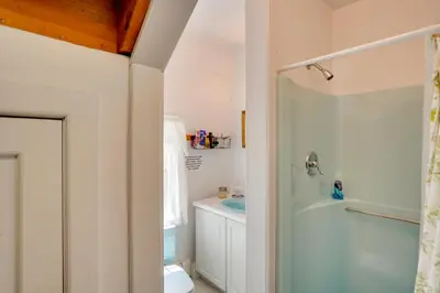 a bathroom with a shower and a sink and a tub at Waterfalls and Trails at The Mills At Green Hole in Hillsdale