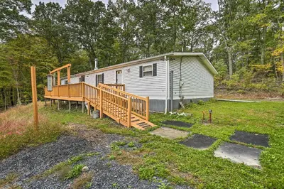 a mobile home with a porch and a deck at Port Jervis Home about 8 Acres with Mountain View! in Port Jervis