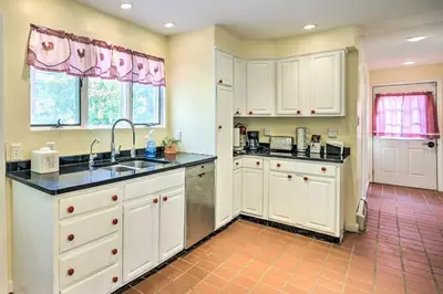 a kitchen with white cabinets and a sink at Pet-Friendly Latham Retreat about 7 Mi to Albany! in Latham