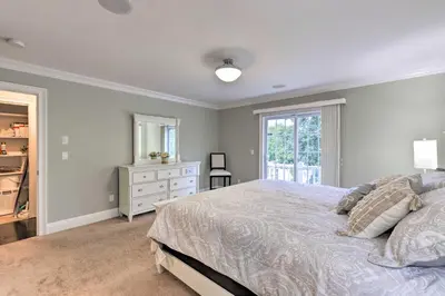 a bedroom with a bed and a dresser and a window at 25 Mi to NYC Cozy Long Island Apt Near Transit in Glen Cove