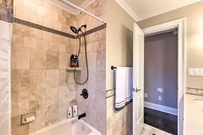 a bathroom with a shower and a bath tub at 25 Mi to NYC Cozy Long Island Apt Near Transit in Glen Cove