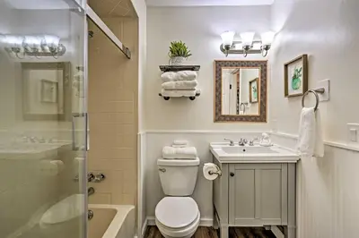 a bathroom with a toilet and a sink and a shower at Vernon Condo with Deck, Near Appalachian Trail! in Vernon Township