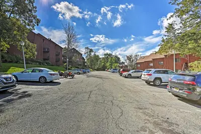 a street with cars parked on the side of the road at Vernon Condo with Deck, Near Appalachian Trail! in Vernon Township