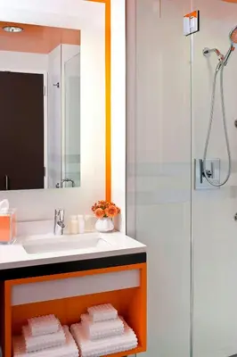 a bathroom with a sink and a shower at Courtyard by Marriott New York Manhattan/Central Park in New York