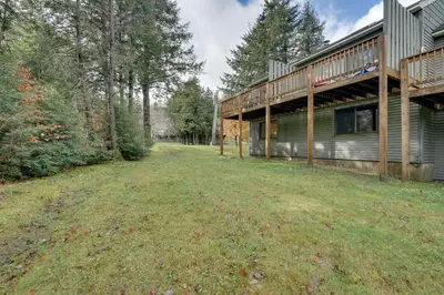 an empty yard in front of a house at Dover Condo with Grill and Balcony 3 Mi to Mt Snow! in Dover