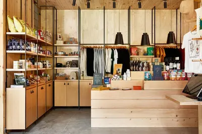 a store with wooden cabinets and shelves in a room at AutoCamp Catskills in Saugerties