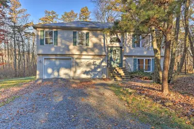 a house with a lion painted on the side of it at Resort Perks and Lake Access Poconos Retreat in Pocono Summit