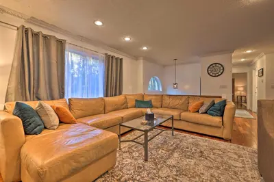 a living room with a couch and a table at Resort Perks and Lake Access Poconos Retreat in Pocono Summit