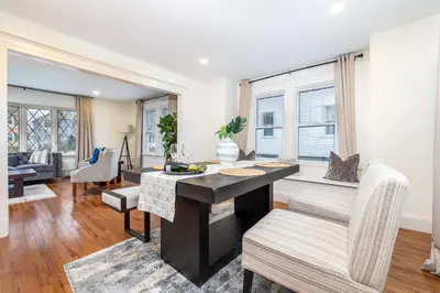 a kitchen and living room with a desk and chairs at Gorgeous 3 bedroom - 9 mins to Hartford, Connecticut in West Hartford