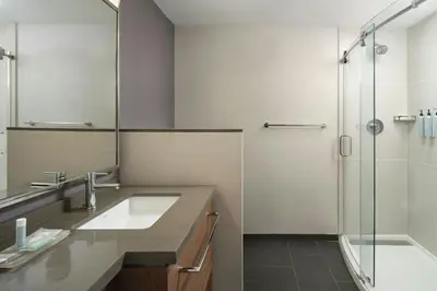 a bathroom with a sink and a shower at Courtyard by Marriott Saratoga Springs in Saratoga Springs