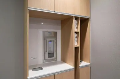 a cupboard with a drink dispenser in it at Courtyard by Marriott Saratoga Springs in Saratoga Springs