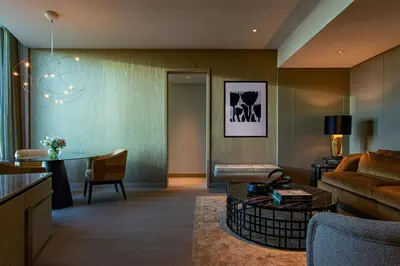a living room with a couch and a table at The Ritz-Carlton New York, NoMad in New York