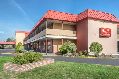 a front view of a restaurant with a red roof at Econo Lodge in West Haven