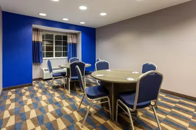 a conference room with a table and chairs at Microtel Inn & Suites by Wyndham Bethel/Danbury in Bethel