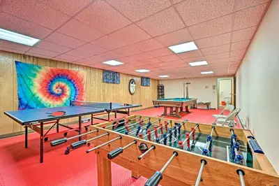 a room with ping pong tables and a rainbow mural at Family Winter Retreat with Hot Tub 14 Mi to Slopes! in Whitingham