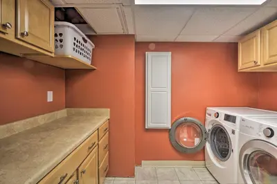 a laundry room with a washer and a washing machine at Family-Friendly Woodbury Home with Yard and Deck! in Woodbury