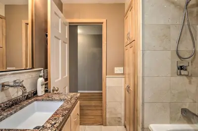 a bathroom with a shower and a sink at Family-Friendly Woodbury Home with Yard and Deck! in Woodbury