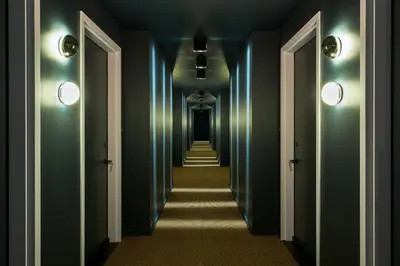 a hallway with green walls and a long corridor at Radio Hotel in New York