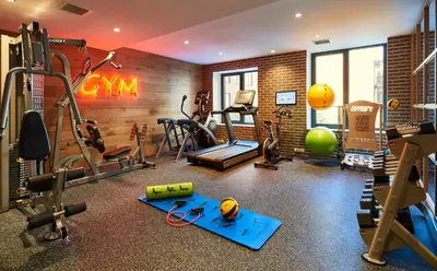 a gym with weights and exercise equipment in a room at Radio Hotel in New York