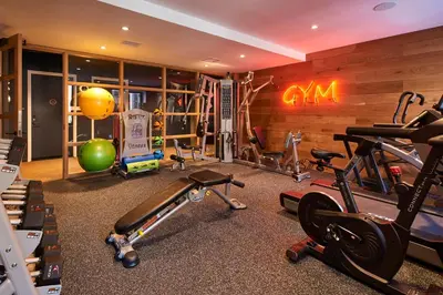 a gym with several exercise equipment in a room at Radio Hotel in New York