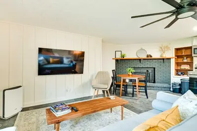 a living room with a couch and a table at Modern Studio Less Than 13 Mi to Saratoga Racetrack! in Ballston Spa