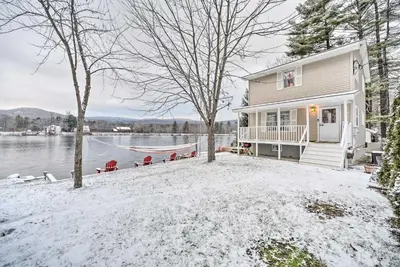 a house with a hammock in the snow at Lake Luzerne Home with Fire Pit on Hudson River in Lake Luzerne