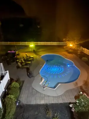 a swimming pool at night with a blue object at 9 Bedroom Saratoga Retreat, In-Ground Heated Pool, HotTub, Firepit, Gourmet Kitchen, Private Office in Saratoga Springs