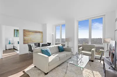 a living room with a couch and a table at Global Luxury Suites Downtown White Plains in White Plains