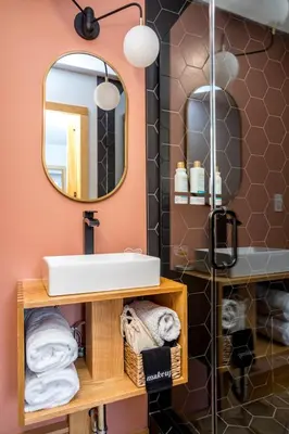 a bathroom with a sink and a mirror at The Herwood Inn in Woodstock