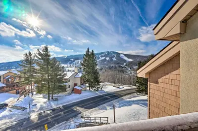 a view of a snow covered mountain from a building at Steps to Ski Shuttle! Snow Mountain Village Condo in Dover