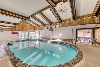 a large indoor swimming pool in a building at Snow Country Home in Wilmington
