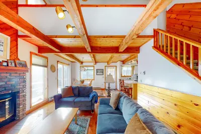 a living room with a couch and a fireplace at Snow Country Home in Wilmington