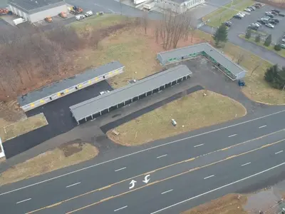 an aerial view of a bus station next to a road at SKYVIEW MOTEL in Castleton-on-Hudson