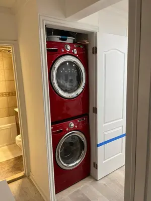 a red washer and dryer in a room at Renovated Jacuzzi Tub Home NYC-LGA-JFK Washer-Dryer in Kew Gardens