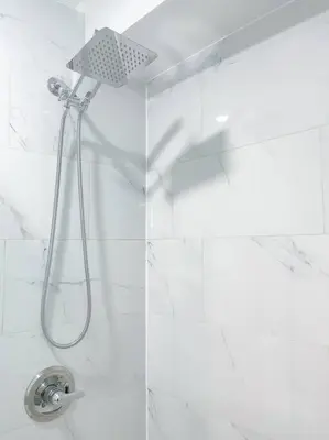 a shower with a shower head in a bathroom at Luxurious Room near LaGuardia & JFK in Corona