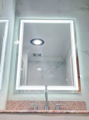 a mirror above a sink in a bathroom at Luxurious Room near LaGuardia & JFK in Corona