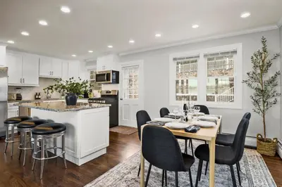 a kitchen and dining room with a table and chairs at Waterview house walking distance from Cove Beach-5 mins to downtown-only 40 min to NYC in Stamford