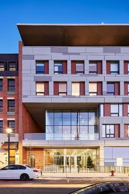 a white car parked in front of a building at Harmony Lofts on Jackson 2 in Hoboken