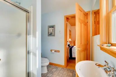 a bathroom with a toilet and a sink at Secluded Vermont Retreat Outdoor Pool and Deck in Stratton